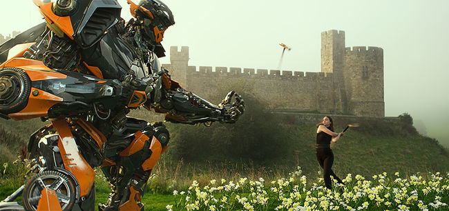 Left to right: Hot Rod and Laura Haddock as Viviane Wembly in TRANSFORMERS: THE LAST KNIGHT, from Paramount Pictures.