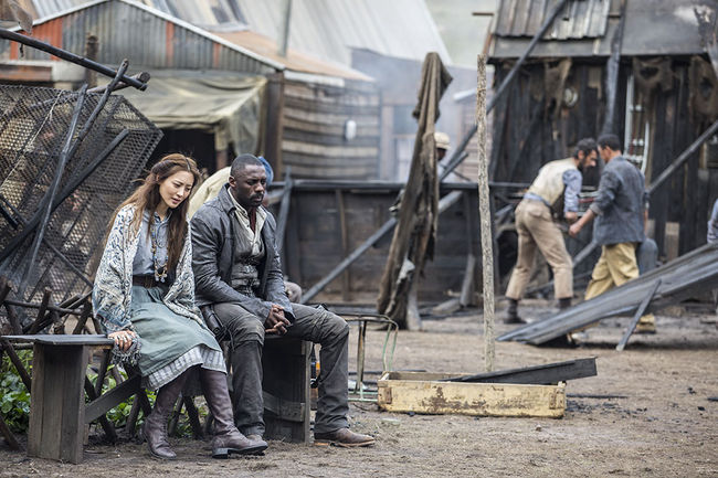 Arra (Claudia Kim) and Roland (Idris Elba) in Manni Village - in Columbia Pictures' THE DARK TOWER