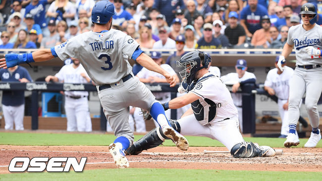 6회최 2사 1루 다저스 먼시의 선취 1타점  적시타때 1루 주자 테일러가 홈쇄도하고 있다. / soul1014@osen.co.kr