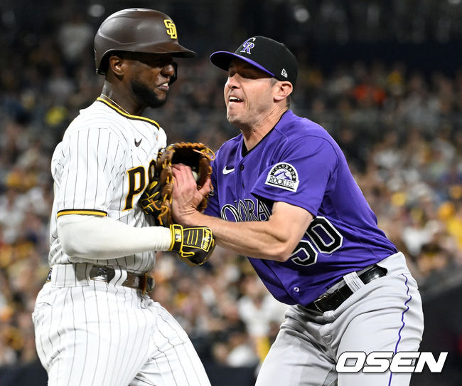 5회말 2사 만루 상황 샌디에이고 주릭슨 프로파가 내야 땅볼을 치고 1루로 뛰며 타구를 잡은 콜로라도 투수 타이 블락과 충돌하고 있다. 2022.06.11 / dreamer@osen.co.kr