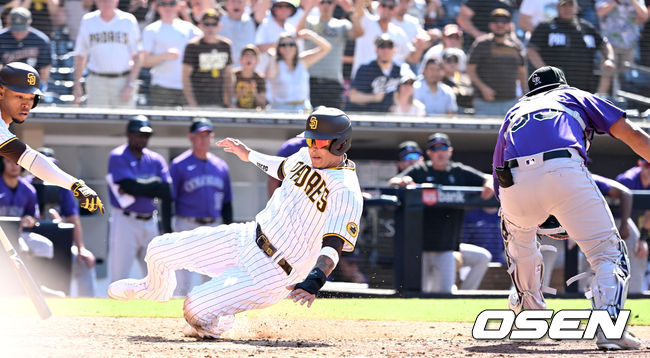 샌디에이고 매니 마차도가 홈으로 파고들어 끝내기 득점을 올리고 있다. 2022.06.12 / dreamer@osen.co.kr