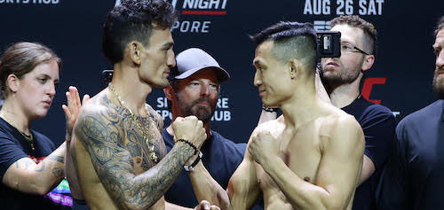 SINGAPORE, SINGAPORE - AUGUST 25: (L-R) Opponents Max Holloway and Chan Sung Jung of South Korea face off during the UFC Fight Night ceremonial weigh-in at Singapore Indoor Stadium on August 25, 2023 in Singapore. (Photo by Suhaimi Abdullah/Zuffa LLC via Getty Images)