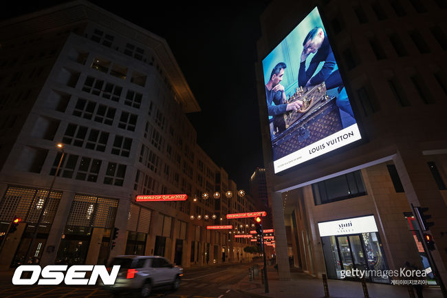 DOHA, QATAR - DECEMBER 02: A view of a Louis Vuitton advertisement campaign featuring Lionel Messi and Cristiano Ronaldo during the FIFA World Cup Qatar 2022 at Msheireb Downtown Doha on December 02, 2022 in Doha, Qatar. (Photo by Alex Pantling/Getty Images)