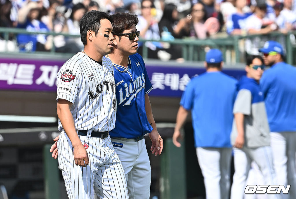 18일 부산 사직야구장에서 2025 신한 SOL 뱅크 KBO 리그 롯데 자이언츠와 삼성 라이온즈의 경기가 열렸다. 홈팀 롯데는 데이비슨, 방문팀 삼성은 이승현이 선발 출전했다.삼성 라이온즈 강민호가 5회말 2사 윤동희의 머리로 향한 삼성 라이온즈 양창섭의 투구에 벤치 클리어링을 한 후 전준우를 달래고 있다. 2025.05.18 / foto0307@osen.co.kr