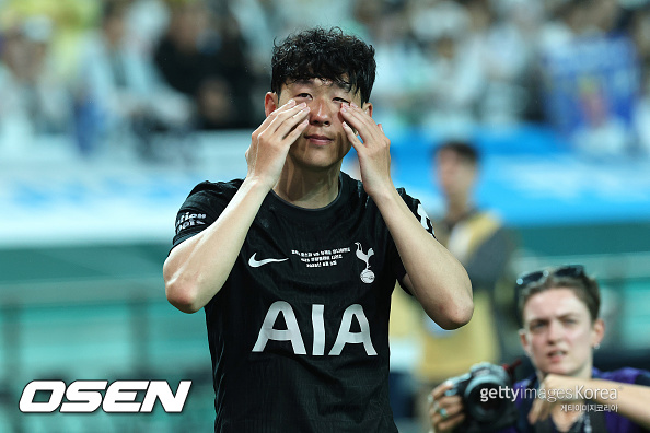 SEOUL, SOUTH KOREA - AUGUST 03: Heung Min Son of Tottenham Hotspur wipe away his tears during the pre-season friendly between Tottenham Hotspur and Newcastle United at Seoul World Cup Stadium on August 03, 2025 in Seoul, South Korea. (Photo by Han Myung-Gu/Getty Images)