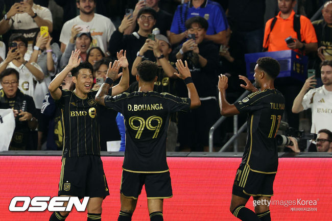 LOS ANGELES, CALIFORNIA - OCTOBER 29: Son Heung-Min #7 and Denis Bouanga #99 of LAFC celebrate after an own goal by Brendan Hines-Ike #4 of Austin FC during the first half of their 2025 MLS Cup Playoffs game at BMO Stadium on October 29, 2025 in Los Angeles, California. (Photo by Kevork Djansezian/Getty Images)