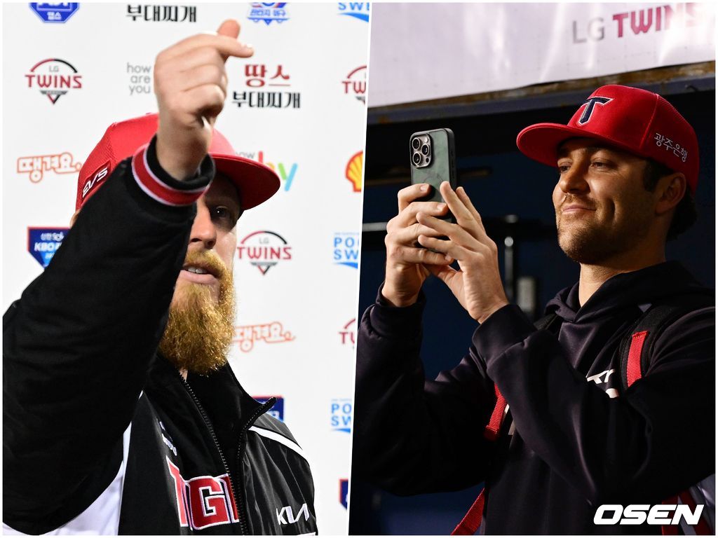 올러의 모습 휴대전화에 담고